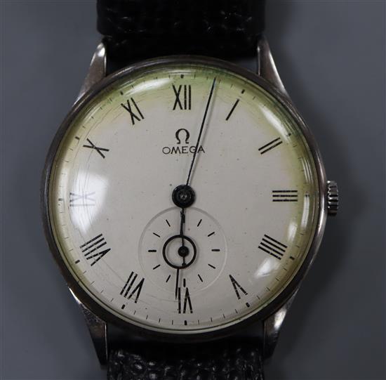 A gentlemans early 1940s Omega manual wind wrist watch, with Roman dial and subsidiary seconds,